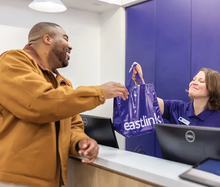 eastlink employee smiling to customer